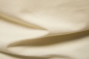 Detailed view of soft solid color cotton fabric, smooth texture for summer men t-shirt.
