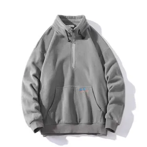 Grey half-zip fleece sweatshirt detail showing collar tag, soft fabric texture and pocket.