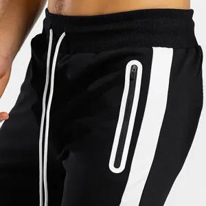 Men's athletic sweatpants detail view, showing adjustable drawstring and side pocket design.