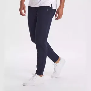 Detail shot of mens navy blue slim fit casual stretch sweatpants with comfortable cuffs.