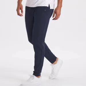 Men's slim fit casual trousers detail shot showing dark blue elastic waistband active pants