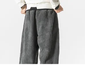 Detail view of men's dark gray corduroy trousers showing soft texture and comfortable fit.