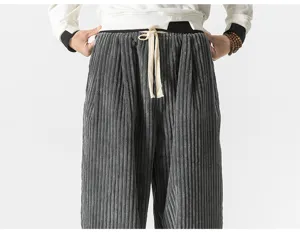 Men corduroy casual harem pants detail shot, loose fit straight trousers with drawstring waist.