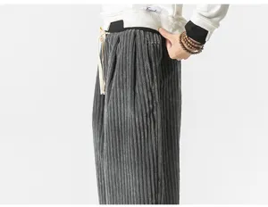 Corduroy trousers detail view showcasing soft fabric texture and adjustable drawstring waist.