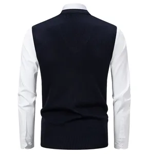 Back view of men's casual knit sweater vest layered with white long sleeve shirt detail.