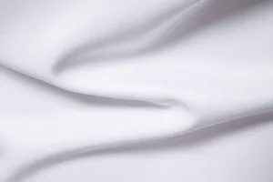 Close-up fabric detail of men's casual long sleeve shirt, showing soft white texture.