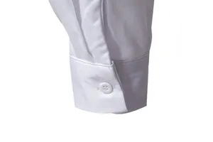 Detailed shot of men's casual long sleeve shirt white cuff with button, clean studio view.