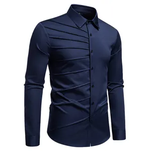 Men's dark blue long sleeve shirt detail, featuring unique diagonal pleats and classic collar.