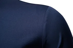 Men's casual shirt shoulder detail closeup showing smooth fabric and neat stitching work.