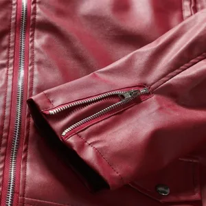 Close-up detail of mens red faux leather jacket sleeve zipper, high quality hardware.