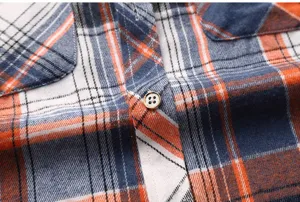 Men's casual plaid short sleeve shirt fabric detail, classic check pattern, button placket.