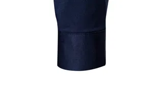Detailed close-up view of the smooth navy blue men's shirt sleeve cuff with fine stitching.