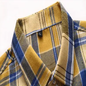 Close up detail of mens yellow blue plaid shirt collar and buttons showing fine stitching work.