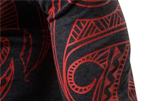 Men's fitness long sleeve detail view, showing stretchy fabric with red tribal print.
