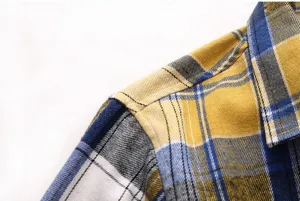 Men's plaid short sleeve shirt detail view showing fabric texture and shoulder seam.