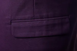 Men's suit vest dark purple fabric pocket detail close-up showcasing fine stitching craftsmanship.