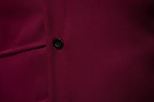 Wine red men's long sleeve shirt fabric detail close up view, casual button placket style.