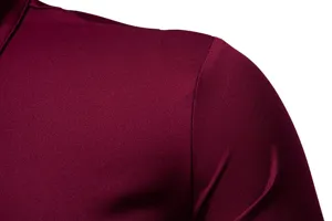 Men's casual long sleeve shirt detail, burgundy fabric texture and shoulder seam closeup.