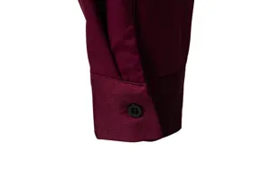 Burgundy mens long sleeve shirt cuff detail with black button and fine stitching.