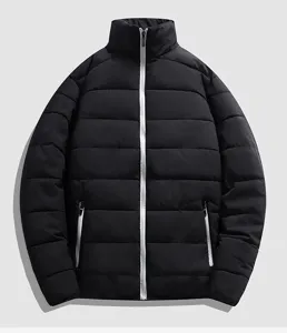 Closeup details of the black winter puffer jacket with stand collar and white zipper.