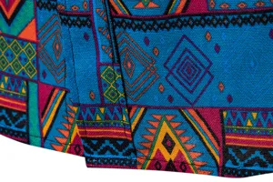 Close up detail of mens ethnic geometric print long sleeve shirt fabric texture colorful.