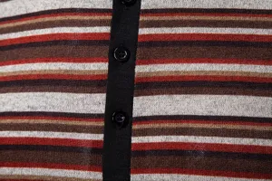 Detailed view of men's knitted striped short sleeve polo shirt featuring classic multi-color stripes.