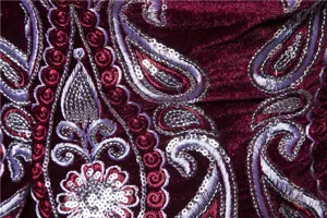 Burgundy velvet suit fabric detail with silver embroidery and shimmering sequins for men.