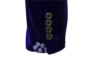 Velvet suit sleeve detail showing metallic buttons and elegant silver thread embroidery design.