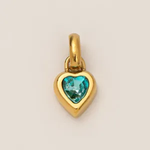 Gold heart pendant in stainless steel with a teal blue gemstone heart for jewelry DIY.