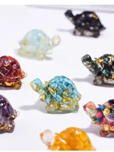 Macro view of colorful resin money turtles with natural crystal chips and gold foil