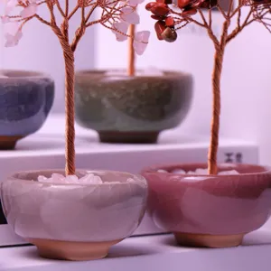 Detail shot of handcrafted crystal gemstone trees in colorful ceramic pots for home decor.