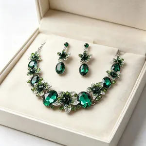 Elegant green crystal floral jewelry set with necklace and drop earrings in a gift box