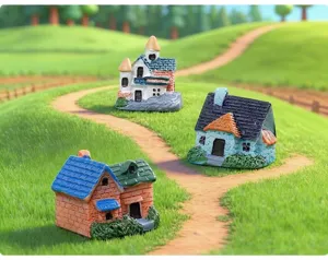 Detailed view of miniature resin houses for micro landscape succulent decoration.