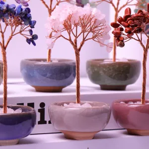 Macro detail of handcrafted crystal money trees with vibrant stones in ceramic pots
