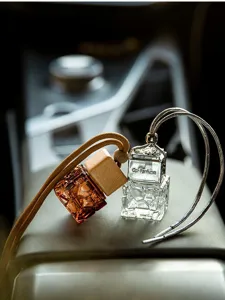 Close-up detail of 10ml water cube textured glass car perfume hanging bottles