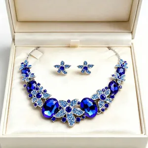 Elegant bridal blue crystal necklace and earrings set displayed in a premium beige jewelry box