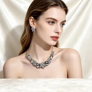 Elegant bridal crystal floral necklace and earring jewelry set worn by a model for weddings