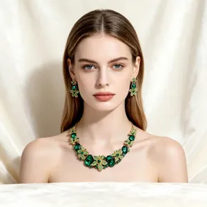 Elegant emerald green crystal floral necklace and earrings set on model