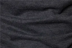 Dark grey stretch fabric texture detail close-up, soft knit material with fine grain.