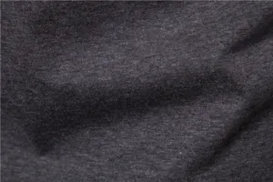 Dark gray stretch fabric detail, premium knitted textile texture close-up for apparel.