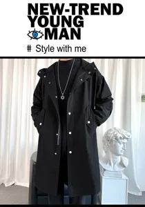 Detail view of men's black hooded long windbreaker coat, stylish streetwear design with snap buttons.