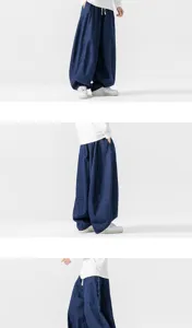Detailed view of loose denim harem pants for men, showcasing wide-leg fit and style.