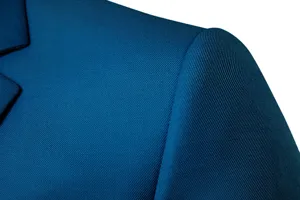 Close-up detail of men's business casual suit shoulder showing fine twill blue fabric texture.