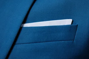 Men's blue suit jacket chest pocket detail shot, professional business casual blazer fabric.