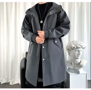 Close-up detail of the stylish men's dark grey hooded long trench coat with snap buttons.