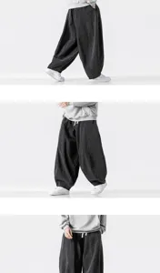 Detailed view of men loose harem denim pants, wide-leg casual streetwear trousers for men.