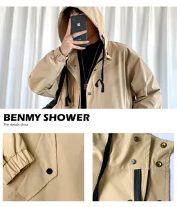 Detailed view of men khaki hooded trench coat showing cuffs, buttons and fabric texture.