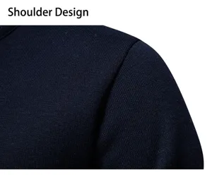 Men's solid color knit sweater shoulder detail showing fine texture and neat stitching craftsmanship.