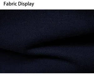 Detailed close-up view of dark blue knitted fabric showing fine texture and high quality.