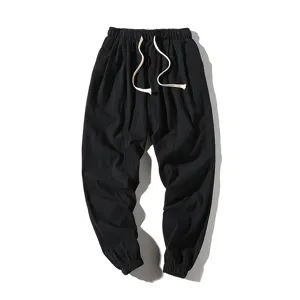 Men's casual black linen harem pants, loose fit lightweight summer trousers with drawstring.